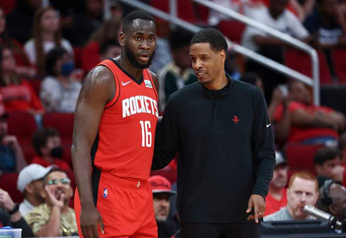 Apr 10, 2022; Houston, Texas, USA; Houston Rockets head coach Stephen Silas talks with forward Usman Garuba (16) during the fourth quarter against the Atlanta Hawks at Toyota Center. Mandatory Credit: Troy Taormina-USA TODAY Sports